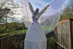Stilt walking snow queen